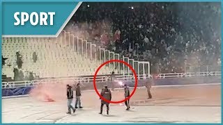 AEK Athens fans throw petrol bomb and fireworks at Ajax supporters [upl. by Oht]