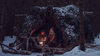 Winter Camping in Bushcraft Shelter  Spruce Bough Bed Long Log Fire Camp Cooking [upl. by Myrna]